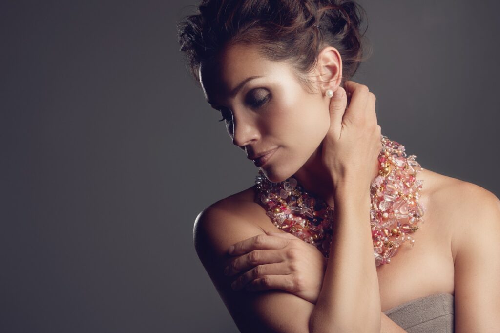 Dressed to impress. A mature woman wearing a stunning necklace.